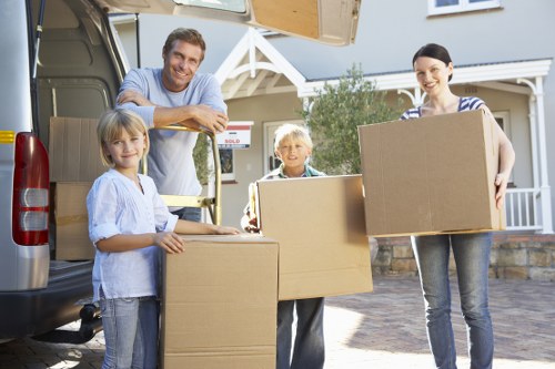 Professional movers packing household items for a Redbridge relocation