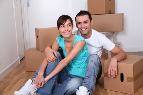 Organised storage unit with boxes and furniture in Redbridge
