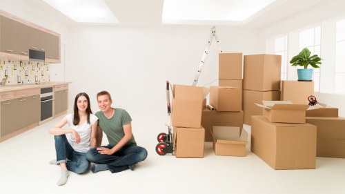 Staff handling furniture with care during loading