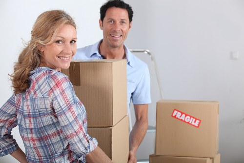 Careful packing of household items by movers in Redbridge