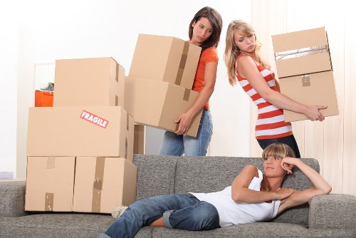 Professional office relocation team handling business equipment in Redbridge