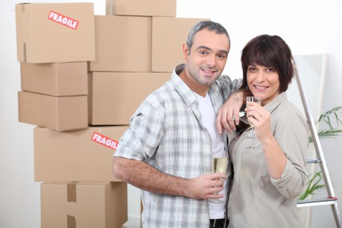 Office relocation team transporting desks and equipment in Redbridge